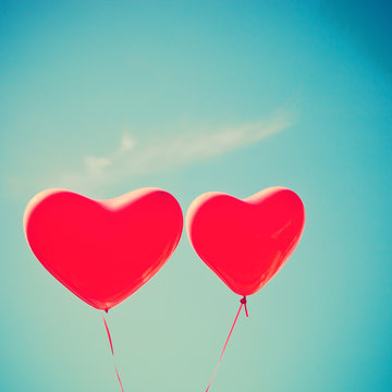 Two red heart-shaped balloons