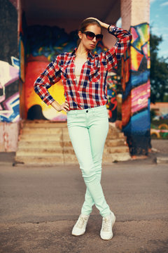 Colorful fashion photo pretty stylish woman posing in the city,
