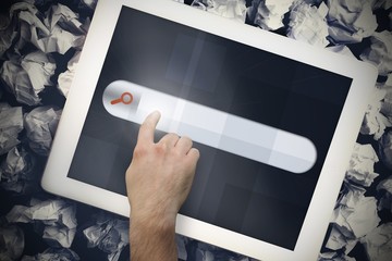 Hands touching search bar on tablet screen