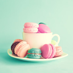 Macaroons in a vintage tea cup