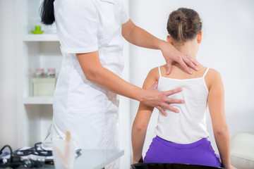 Chiropractor doing adjustment on female patient