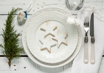 Christmas table - elegant white plate with cookies from above