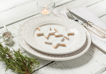 Christmas table - elegant white plate with cookies