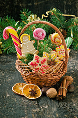 Christmas gingerbread cookies and lollipops in a basket