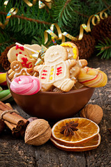 Christmas gingerbread cookies and lollipops in bowl 