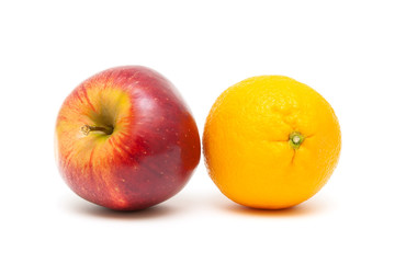 apple and orange close up on a white background