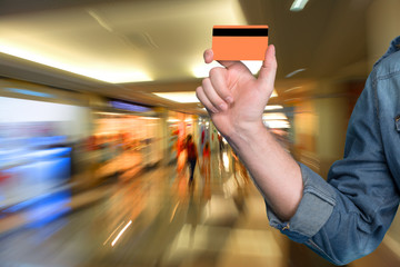 Man holding a credit card in his hand