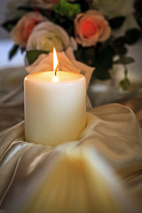Burning Candle on Banquet Table