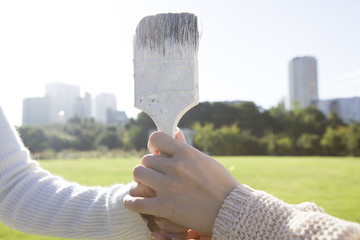 Hand holding the brush