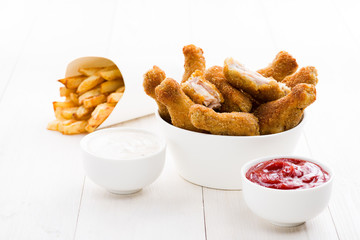 Chicken wings and sauces on the table