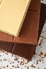 white brown and dark chocolate bar