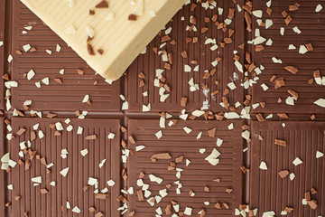white brown and dark chocolate bar
