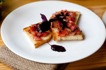 Bruschetta with tomatoes and basil on toasted bread
