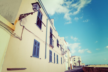 shutters and lamps in Alghero seafront on a clear day