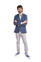 Businessman with his arms crossed over white background