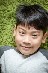 Obraz premium happy asian child having good time in the park.