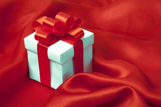 gift on red satin background