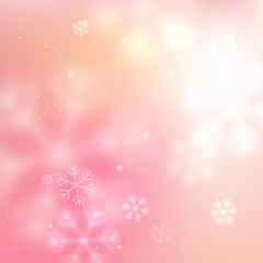 Pink blurred snowflakes background