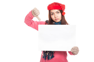 Asian girl with red christmas hat show blank sign and thumbs dow