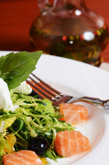 Salad with salmon and mascarpone cheese, pomelo leaves, lettuce