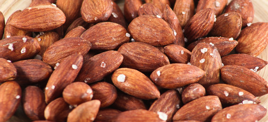 Salted Roasted Almonds Nuts on Wooden Surface 