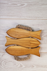 Cutting board with space for text on wooden background, close-up