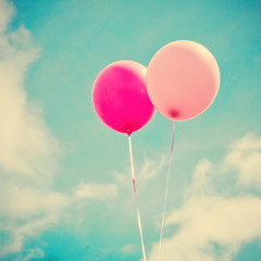 Fototapeta na wymiar Vintage colorful balloons in flight