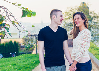 Naklejka premium Young happy couple posing outdoor