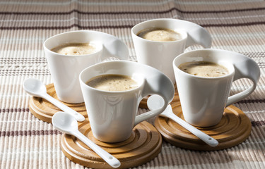 cups of coffee on place mats
