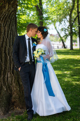 Bride and Groom at wedding Day walking Outdoors on spring nature