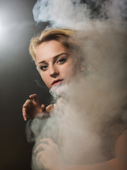 Portrait of the girl with a smoke