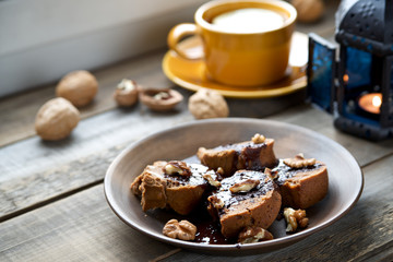 Cake with chocolate and tea with lemon