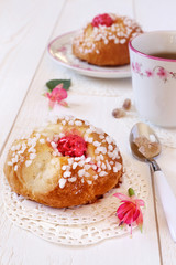 Sweet breakfast in pink: French buns and a cup of tea