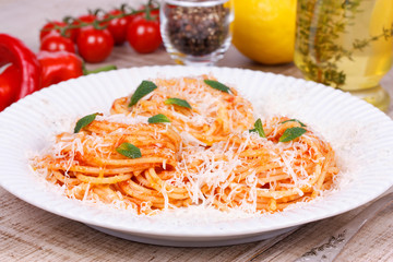 Italian pasta with tomato sauce, cheese and mint