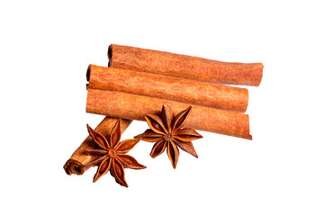 Cinnamon sticks and star anise isolated over a white background