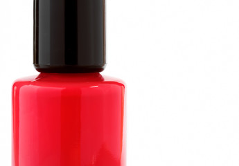 Bottle of red nail polish on white background