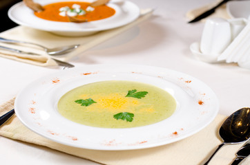 Plate of creamy vegetable soup with coriander