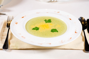 Plate of creamy vegetable soup with coriander