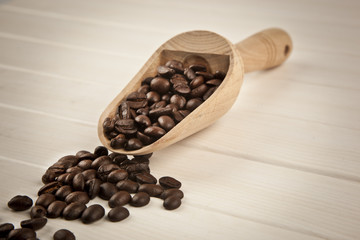 coffee beans with wooden spoon