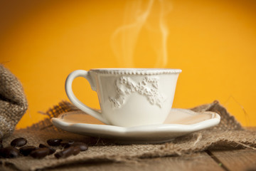 Turkish Coffee with yellow background on wooden table
