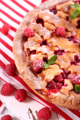 Tasty cake with berries on table close-up