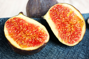 Ripe sweet figs on wooden background
