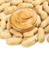 Creamy peanut butter in bowl, isolated on white