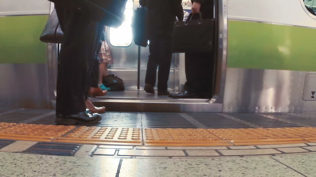 Business men board subway car in slow motion