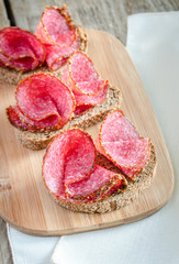Fototapeta na wymiar Sandwiches with italian salami