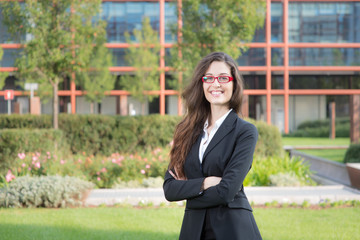 Fototapeta premium Portraig of a young student on a modern building background