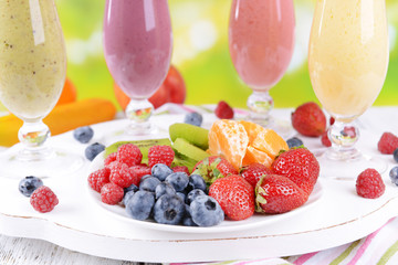Delicious berry cocktails on table close-up