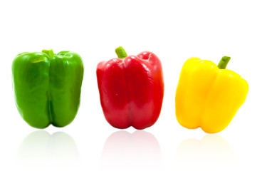 three fresh sweet pepper on white background
