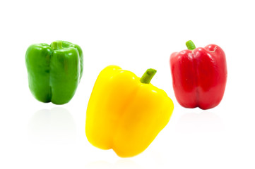 three fresh sweet pepper on white background