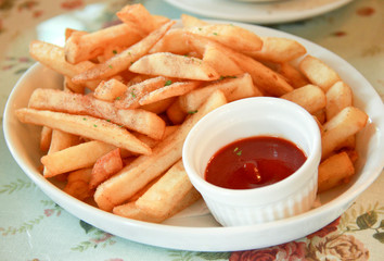 Freshly french fries with ketchup (tomato sauce)